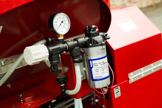 Shredder mill with optional acid inoculation kit shown Detail of optional acid inoculation kit on Horning shredder mill